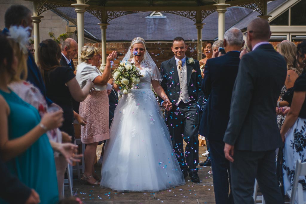 Newlyweds confetti after wedding ceremony at Mount Pleasant Hotel in Doncaster