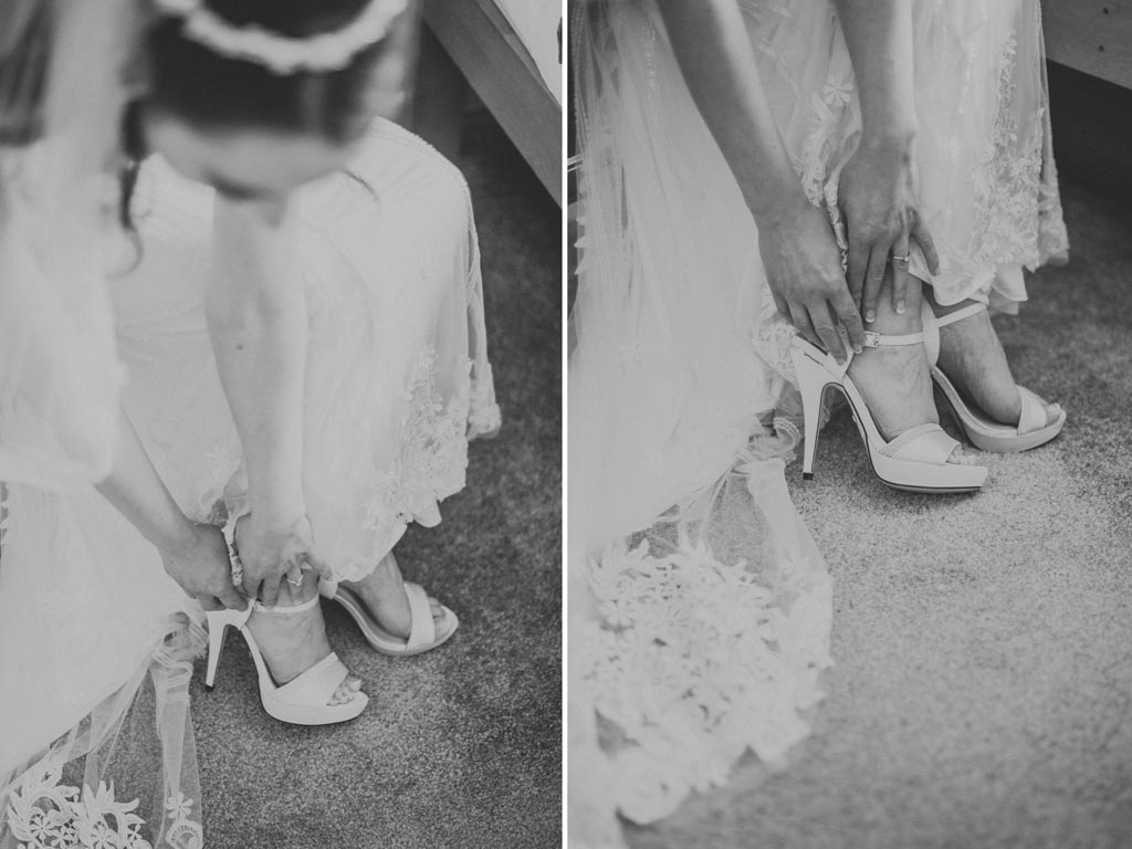 Bride putting shoes on