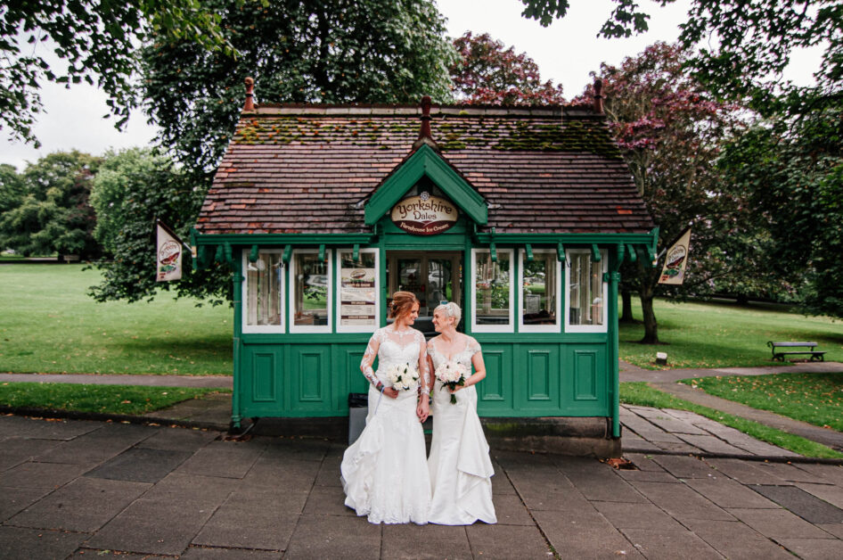 Two brides posing for photos in Harrogate after a wedding at Hotel DuVin