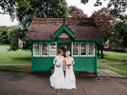 Two brides posing for photos in Harrogate after a wedding at Hotel DuVin