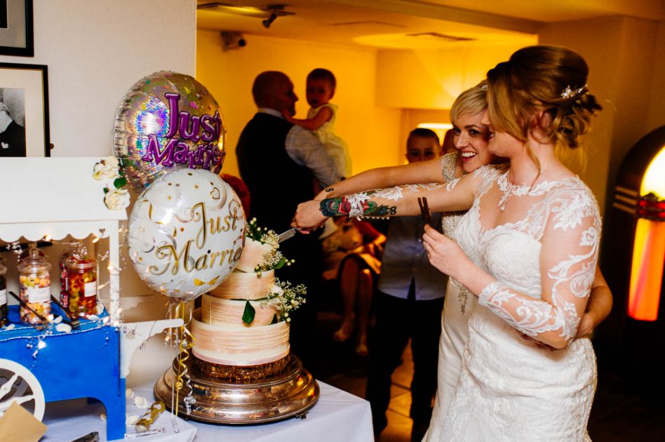 Brides cutting cake at Hotel du Vin Harrogate wedding