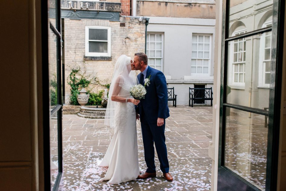 Bride and groom in Priory Place's courtyard