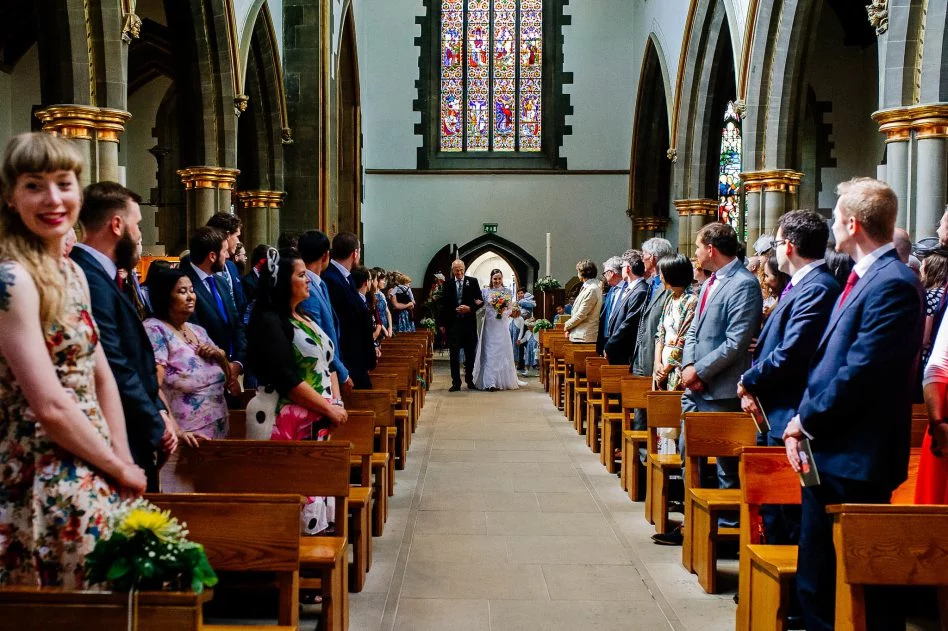 Bride walking down the aisle at Sheffield Cathedral