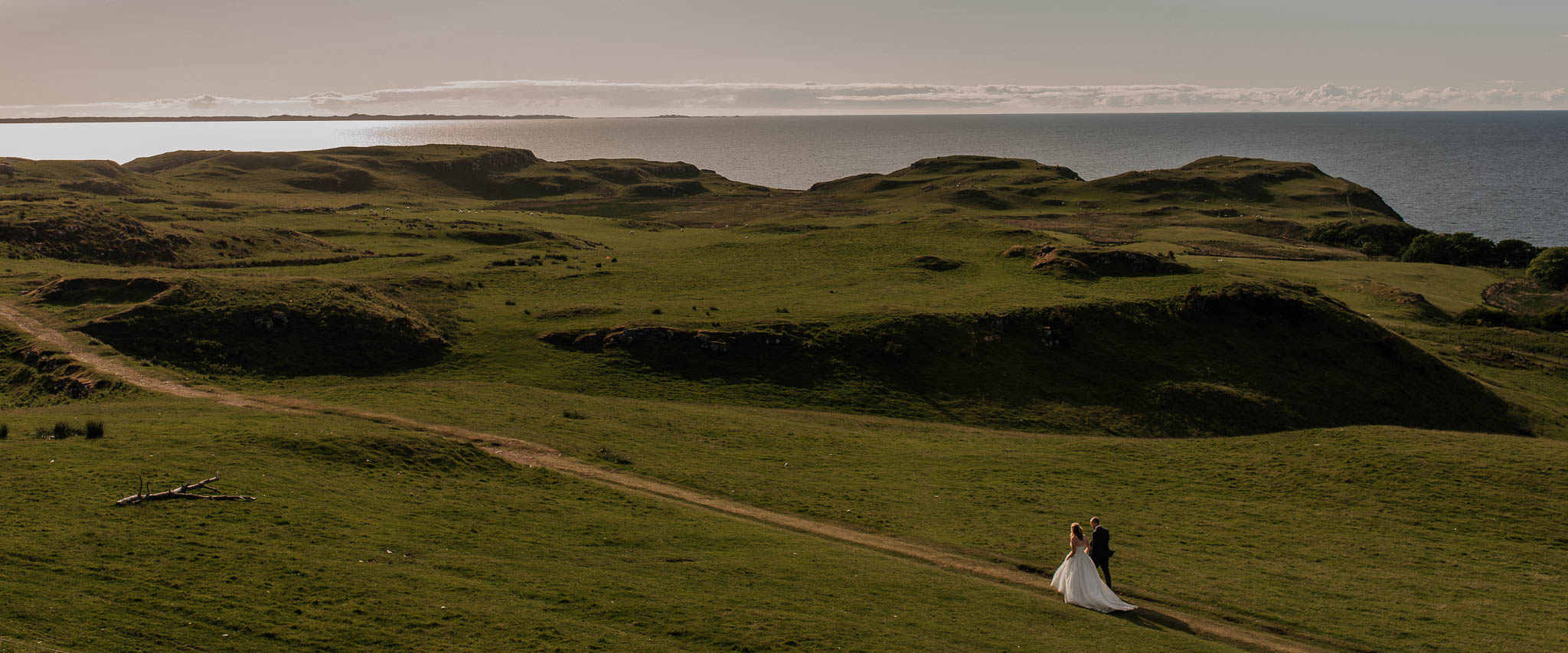 Bride and groom walking together on the Isle of Mull in Scotland