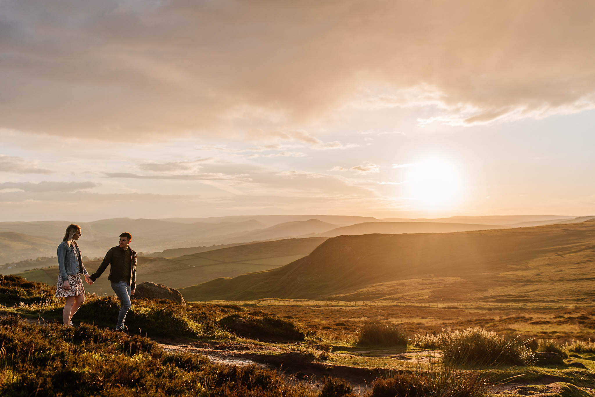 Couple walking in Peak District during an engagement photo shoot