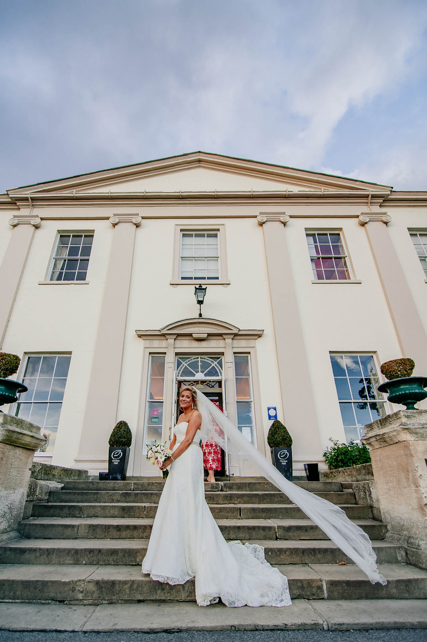 Bride with veil outside Owston Hall Wedding venue in Doncaster