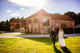 Bride and groom walking during a wedding photo shoot near Rotherham