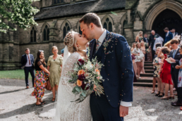 wedding photography of a newly married couple outside a church near Rotherham