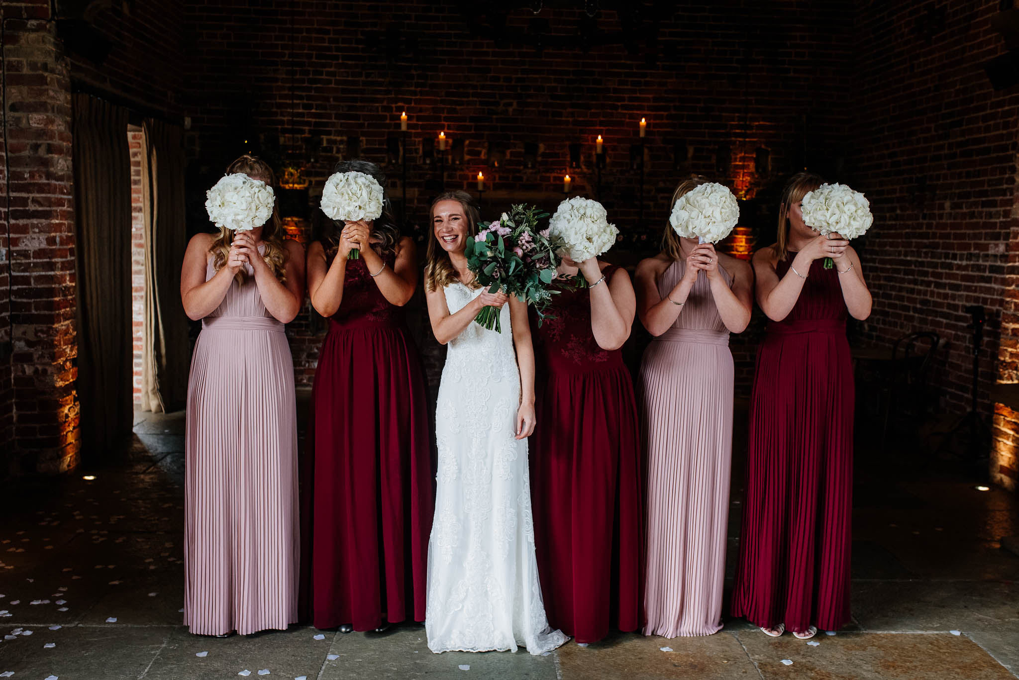 Bride having a lovely time with her bridesmaids during a photo shoot