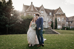 Newly weds outside on their wedding day in Sheffield