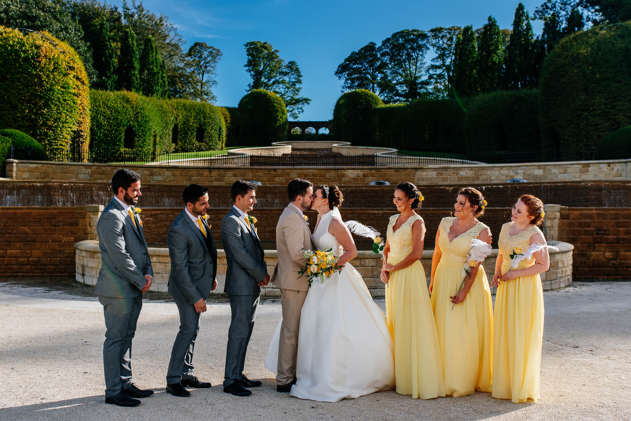 A group photograph with bride, groom, bridesmaids and groomsmen