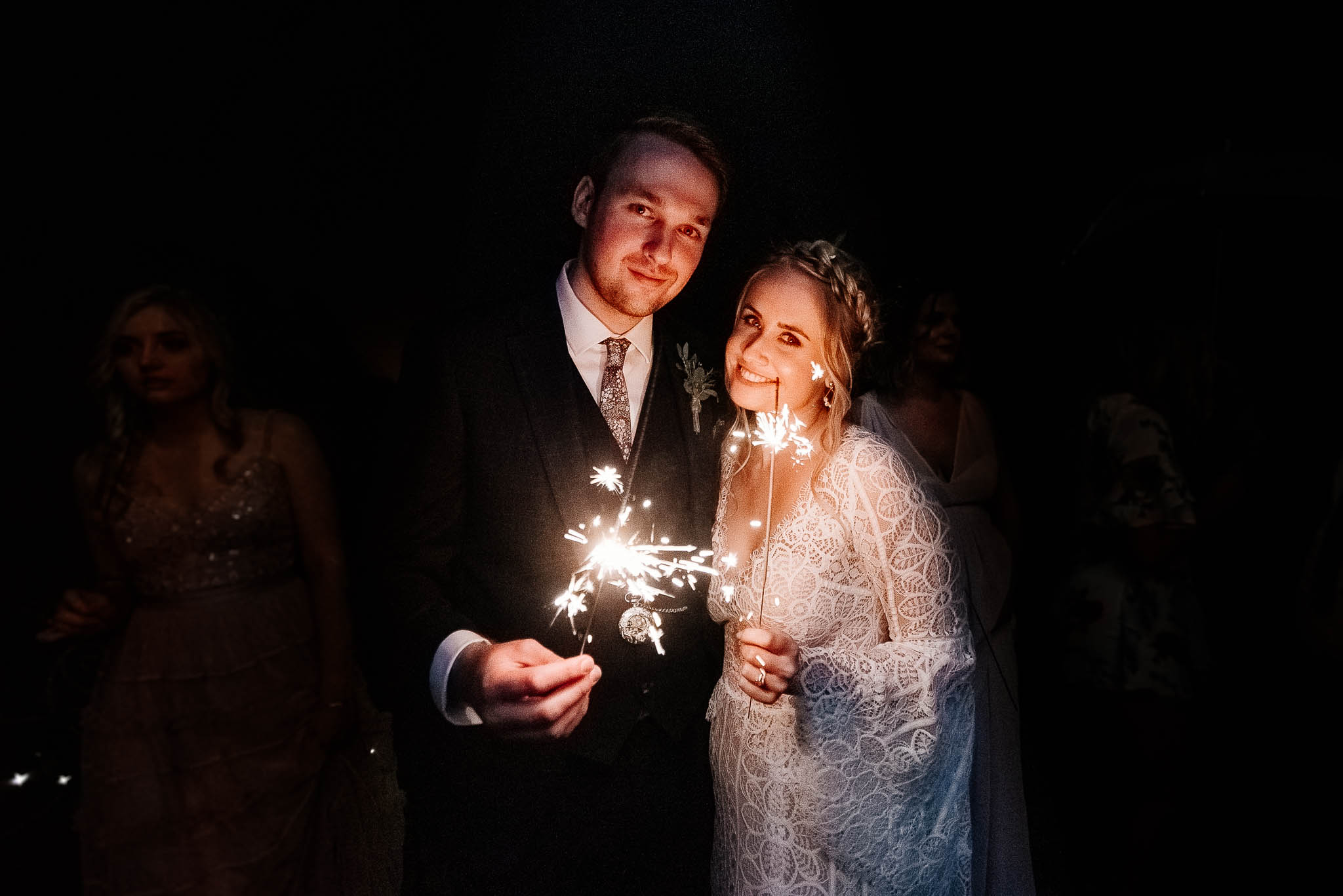Bride and groom with parklers at Whirlowbrook Hall