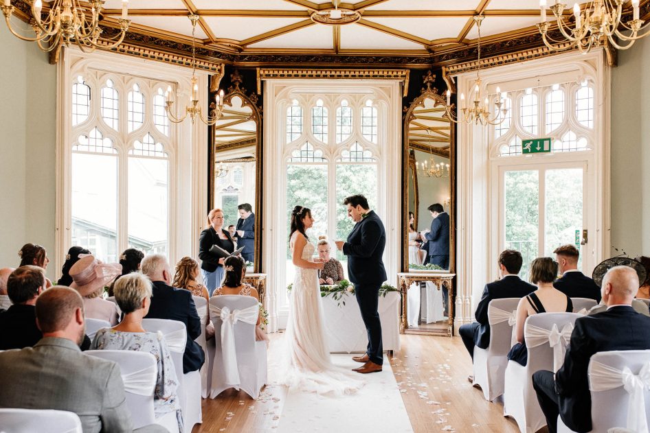 Couple exchanging vows in the ceremony room at Kenwood Hall.