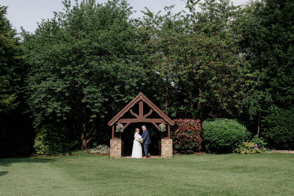 The wooden pagoda in the back garden at Thornhurst Manor is a perfect spot for some bride and groom photos.